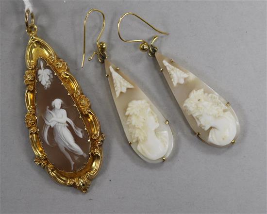 A yellow metal mounted pear shaped cameo pendant and a pair of yellow metal and cameo earrings.